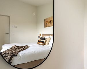 Stylish bedroom with art in Holiday home in Wissenkerke, Noord-Beveland, Zeeland.