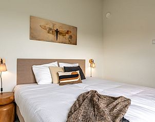 Spacious bedroom in Holiday home in Wissenkerke, Noord-Beveland, Zeeland with open closet.