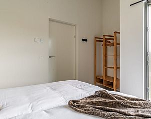 Bedroom with wooden closet in Holiday home in Wissenkerke, Noord-Beveland, Zeeland.