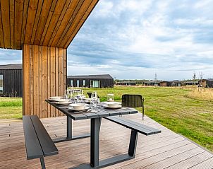 Outdoor area with seating in Holiday home in Wissenkerke, Noord-Beveland, Zeeland.