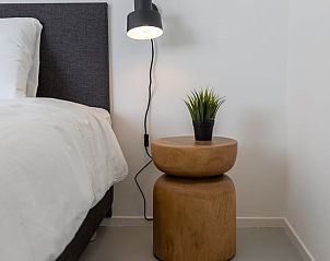 Stylish bedroom of Holiday home in Wissenkerke with modern details in North Beveland, Zeeland.