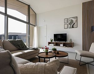 Dining area in Holiday home in Wissenkerke with atmospheric lighting in North Beveland, Zeeland.