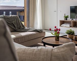 Terrace of cottage in Wissenkerke overlooking the green surroundings of North Beveland, Zeeland.
