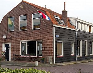 Inn d'n Eenhoorn, ein charmantes Ferienhaus in Colijnsplaat, Noord-Beveland, Zeeland, mit traditioneller Backsteinfassade.
