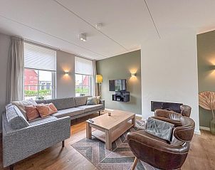 Gezellige woonkamer van Villa Superieur 64 in Colijnsplaat, stijlvol ingericht vakantiehuis in Zeeland.