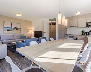 Cozy living room of Villa R8B, a vacation home in Kamperland, North Beveland, Zeeland, with modern kitchen and spacious seating area.