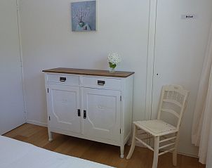 Sfeervol ingerichte slaapkamer in vakantiehuis Zwanenlaan 13 De Schotsman Kamperland