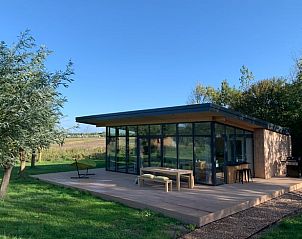 Modern cottage in Kamperland with glass facade and terrace in North Beveland, Zeeland.