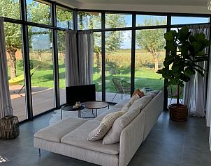 Spacious living room of cottage in Kamperland overlooking the garden in Zeeland.