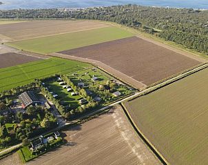 View of fields and nature surrounding cottage Kamperland in North Beveland, Zeeland.