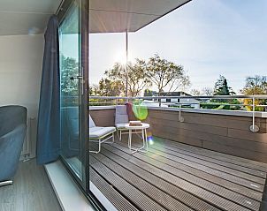 Balkon mit Blick auf die Natur im Ferienhaus Beukenlaan 1 | Ruiterplaat, Zeeland.