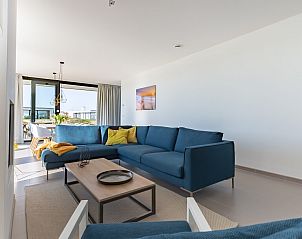 Comfortabele zithoek in Waterlijn 03 | De Groote Duynen, vakantiehuis in Kamperland, Noord-Beveland, met uitzicht.