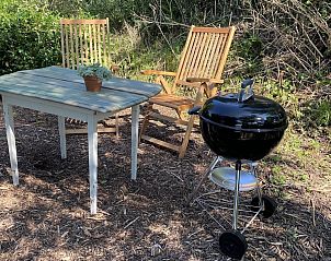 Cozy outdoor area with barbecue at VZ962 Holiday home in Kamperland, ideal for relaxation in North Beveland, Zeeland.