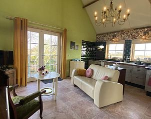 Bright living room of VZ962 Holiday home in Kamperland, with large windows and views of North Beveland, Zeeland.