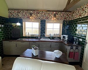Modern kitchen in VZ962 Holiday home in Kamperland, equipped with green tiles in North Beveland, Zeeland.