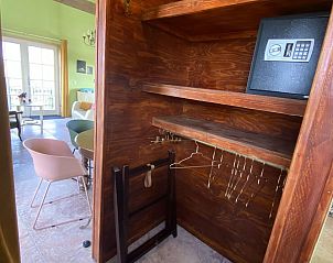 Walk-in closet in VZ962 Holiday home in Kamperland, with wooden shelves and safe in North Beveland, Zeeland.