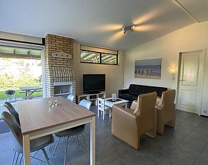 Modern living room of VZ339 Holiday home Kamperland overlooking garden in North Beveland.