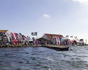 Charming entrance to vacation home ZE1460 in Kamperland, North Beveland, surrounded by greenery.