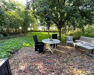 Cozy corner in the living room of vacation home ZE1460 in Kamperland, North Beveland, with comfortable seating.