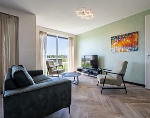 Comfortable sitting area in Veerweg 163 vacation home, Kamperland, Noord-Beveland, Zeeland with views of nature.