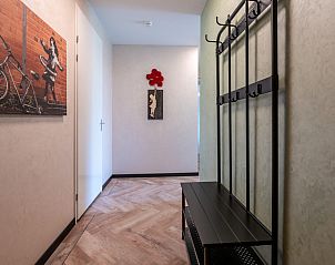 Entrance hall with artwork in Veerweg 163 vacation home, Port Elisabeth, Kamperland, North Beveland, Zeeland.