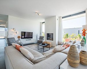 Comfortabele zithoek in vakantiehuis Zandbank 21 | De Groote Duynen, Kamperland, met moderne inrichting.