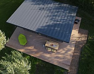 Aerial view of vacation home in Kamperland, surrounded by greenery and tranquility in North Beveland, Zeeland.