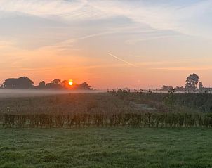 Breathtaking sunrise at vacation home in Kamperland, ideal for early risers in North Beveland, Zeeland.