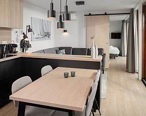 Cozy bedroom in Wellness Lodge 4, a vacation home in Scharendijke, Schouwen-Duiveland, with two comfortable beds.