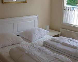 Comfortabele slaapkamer in Mi Casa, Burgh-Haamstede, Zeeland, voor een ontspannen nachtrust in het vakantiehuis.