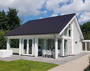 Villa Jula, a stylish vacation home in Renesse, Zeeland, with beautiful terrace and surrounded by nature.
