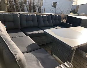 Comfortable seating area on the terrace of VZ1012 Holiday Chalet in Renesse, Schouwen-Duiveland, Zeeland.