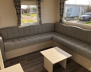 Bright living room with large windows in VZ1012 Holiday chalet in Renesse, Schouwen-Duiveland, Zeeland.