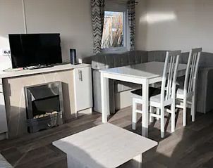 Dining area with view in VZ1012 Holiday chalet in Renesse, Schouwen-Duiveland, Zeeland.