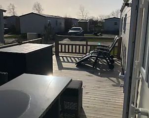 Sunny terrace with view at VZ1012 Holiday chalet in Renesse, Schouwen-Duiveland, Zeeland.