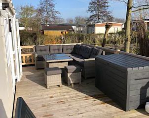 Spacious terrace with luxury furniture at VZ1012 Holiday chalet in Renesse, Schouwen-Duiveland, Zeeland.