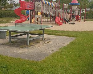 Playground at VZ1012 Holiday chalet in Renesse, ideal for children in Schouwen-Duiveland, Zeeland.