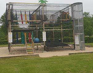 Climbing frame and playground equipment at VZ1012 Holiday chalet in Renesse, Schouwen-Duiveland, Zeeland.