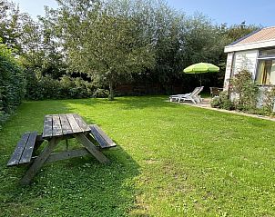 Spacious garden at VZ891 Holiday home in Renesse with picnic table, Schouwen-Duiveland, Zeeland.