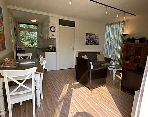 Open kitchen in VZ891 Holiday home in Renesse with garden view, Schouwen-Duiveland, Zeeland.