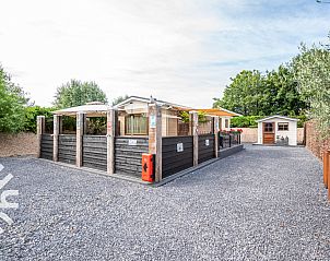 Houten bord met Scharendijke bij vakantiehuis ZE1284, Renesse, Zeeland.