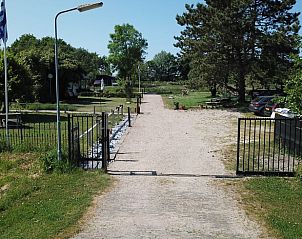 Access road to Holiday home in Renesse, surrounded by greenery and tranquility in Schouwen-Duiveland, Zeeland.
