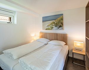 Cozy bedroom with artwork in Holiday home Zonnedorp 22 Anoes, Renesse.