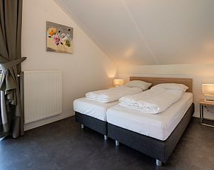 Bedroom with sloping wall in Holiday home Zonnedorp 22 Anoes, Renesse, Zeeland.