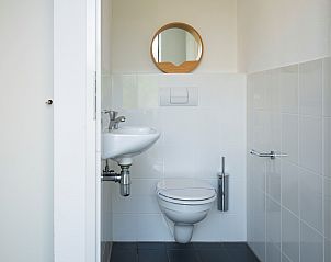 Compact toilet with mirror in Holiday home Zonnedorp 22 Anoes, Renesse.