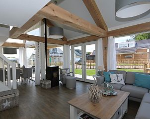 Cozy living room of Holiday Home Zonnedorp 18, Dune House 18 in Renesse, Schouwen-Duiveland with lots of light.