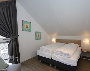 Cozy bedroom in Holiday home Zonnedorp 18, Duinhuis 18 in Renesse, Zeeland with skylight.