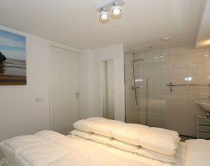 Bedroom with shell art in Holiday home Zonnedorp 18, Duinhuis 18 in Renesse, Zeeland.