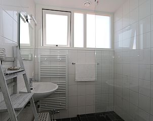 Stairs upstairs in Holiday Home Zonnedorp 18, Dune House 18 in Renesse, Zeeland with wooden details.