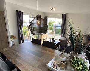 Sitting area with television in VZ804 Vakantiechalet Arend 1833 Renesse, Zeeland